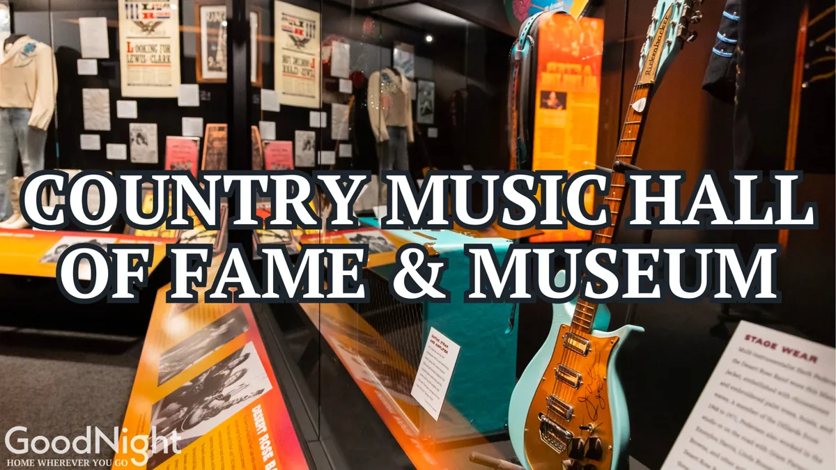 Inside the Country Music Hall of Fame, this image showcases exhibits of stage wear, guitars, and informational plaques. The display invites interaction and exploration, making it attractive to both children and adults interested in music history.